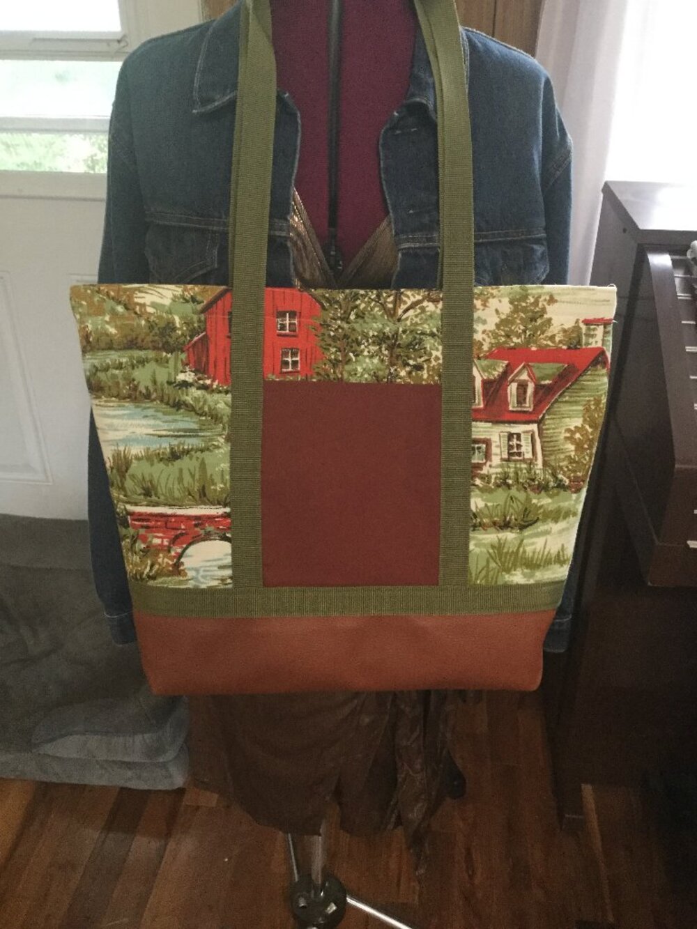 Handmade large tote with faux leather bottom has pocket on outside upcycled